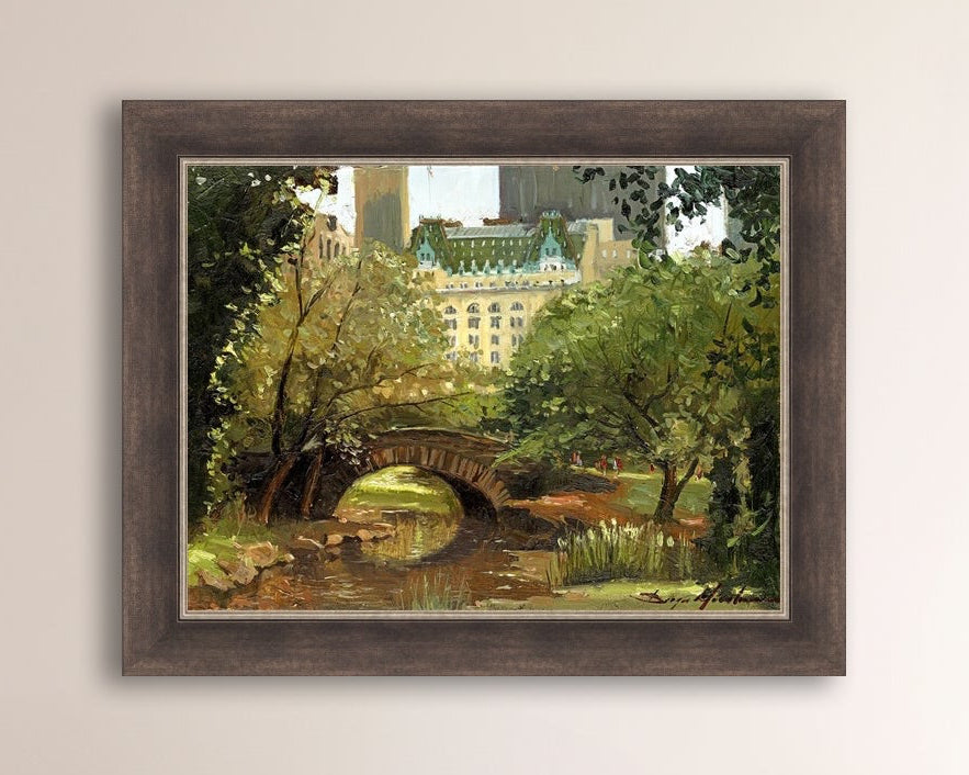 A canvas print of 'Summer in Central Park, New York' featuring bridge in the park and Plaza Hotel in the background.
