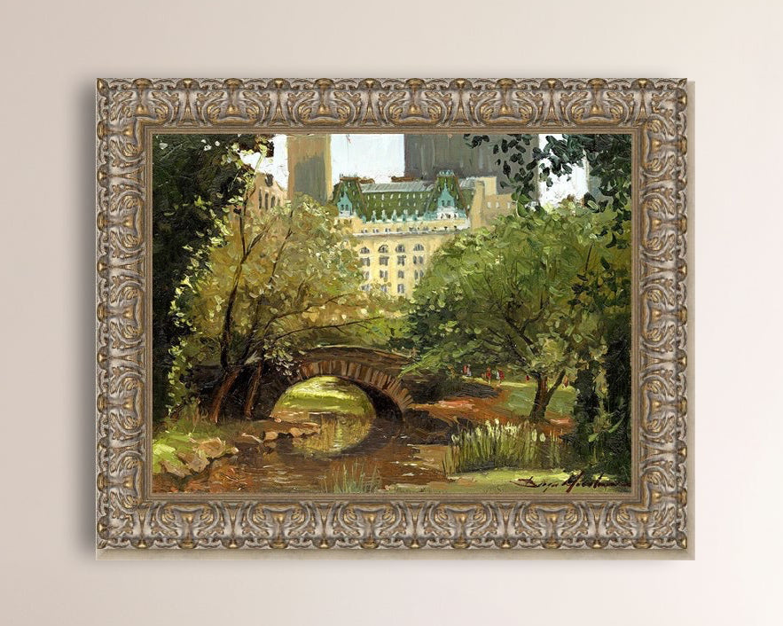 A canvas print of 'Summer in Central Park, New York' featuring bridge in the park and Plaza Hotel in the background.