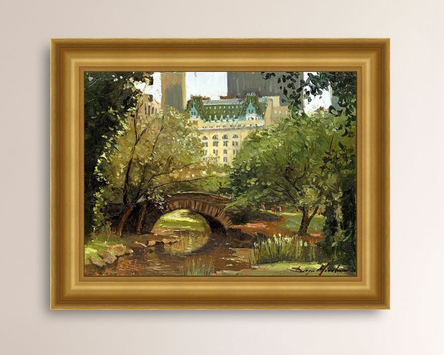 A canvas print of 'Summer in Central Park, New York' featuring bridge in the park and Plaza Hotel in the background.