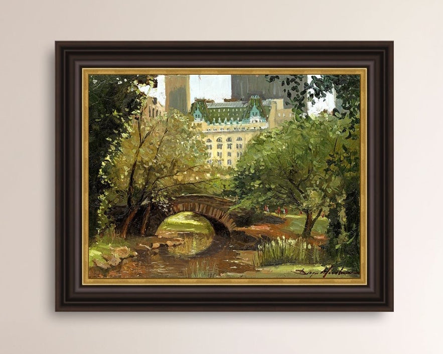 A canvas print of 'Summer in Central Park, New York' featuring bridge in the park and Plaza Hotel in the background.