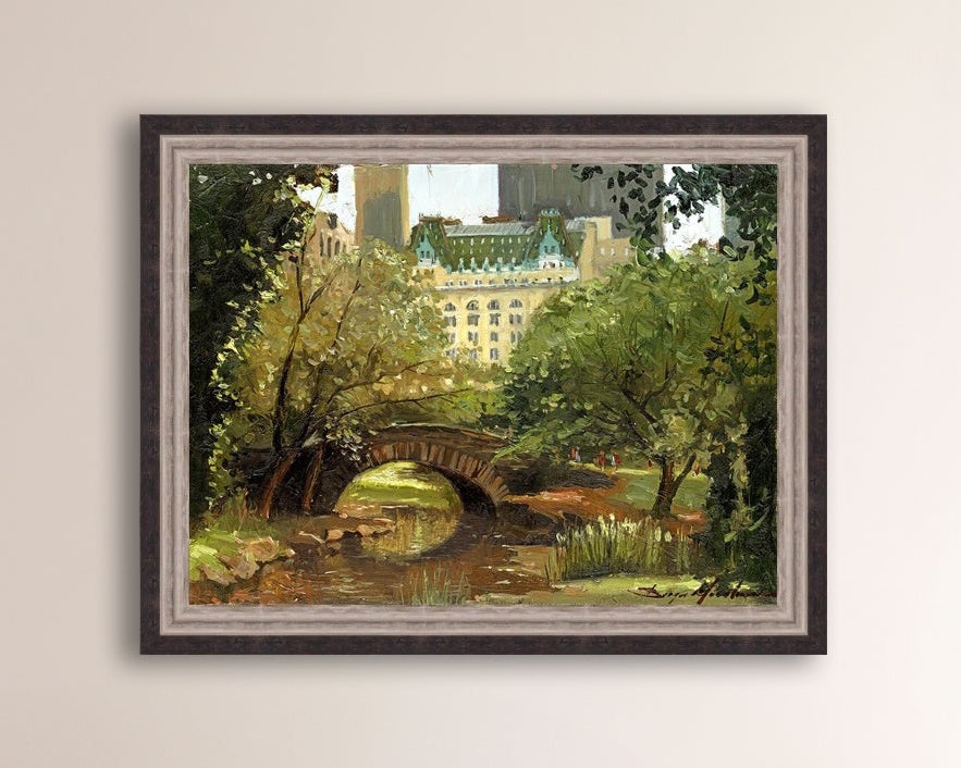 A canvas print of 'Summer in Central Park, New York' featuring bridge in the park and Plaza Hotel in the background.