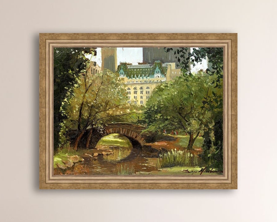 A canvas print of 'Summer in Central Park, New York' featuring bridge in the park and Plaza Hotel in the background.