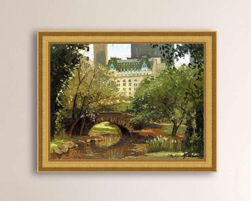 A canvas print of 'Summer in Central Park, New York' featuring bridge in the park and Plaza Hotel in the background.