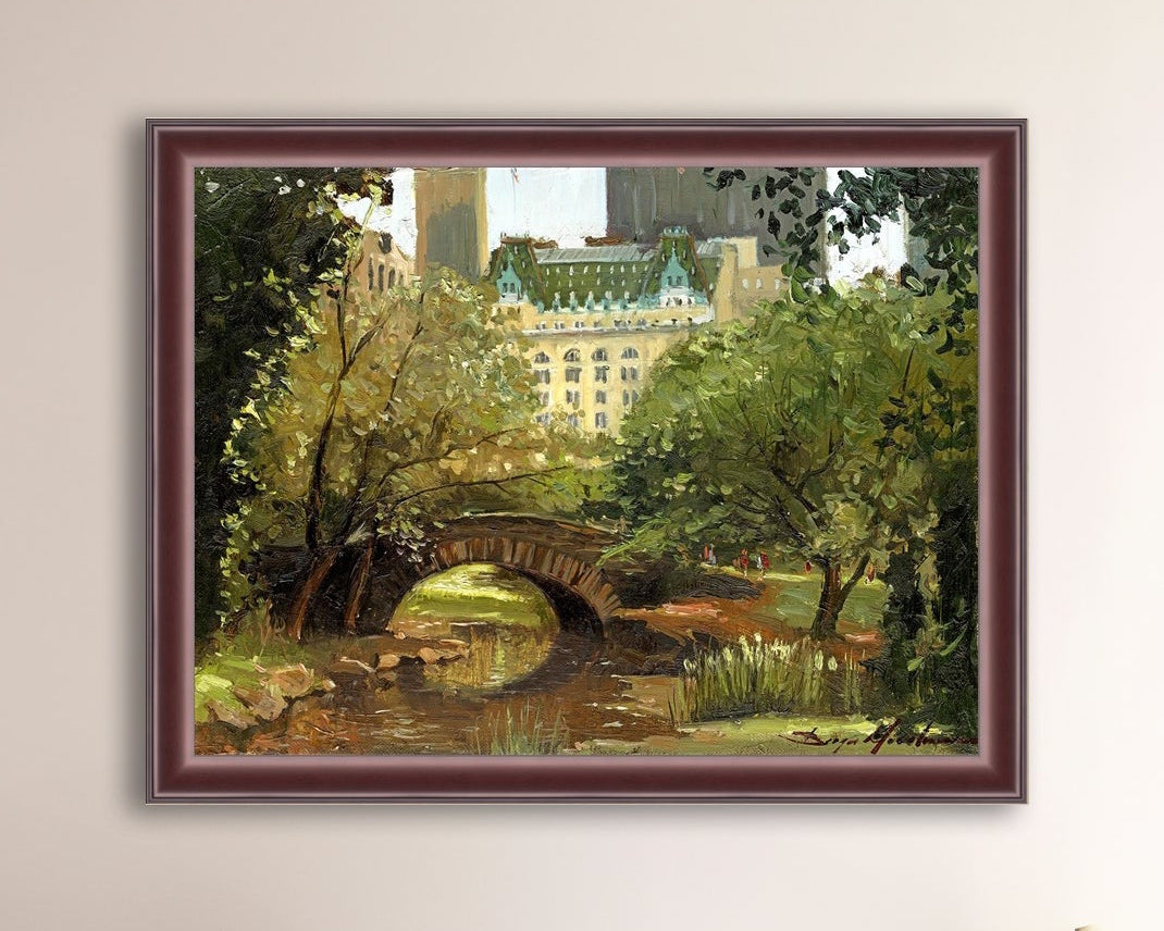 A canvas print of 'Summer in Central Park, New York' featuring bridge in the park and Plaza Hotel in the background.