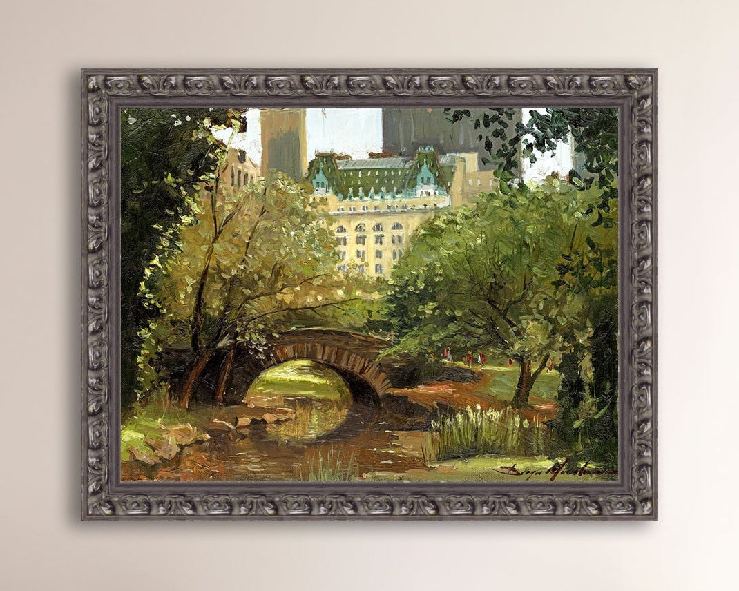 A canvas print of 'Summer in Central Park, New York' featuring bridge in the park and Plaza Hotel in the background.