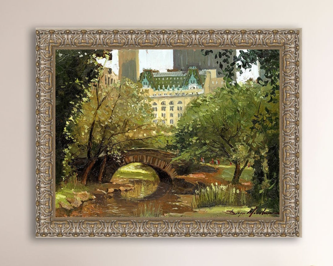 A canvas print of 'Summer in Central Park, New York' featuring bridge in the park and Plaza Hotel in the background.