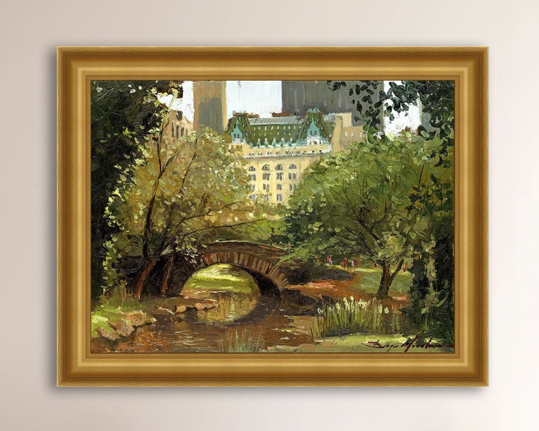 A canvas print of 'Summer in Central Park, New York' featuring bridge in the park and Plaza Hotel in the background.