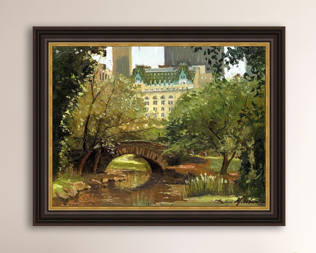 A canvas print of 'Summer in Central Park, New York' featuring bridge in the park and Plaza Hotel in the background.