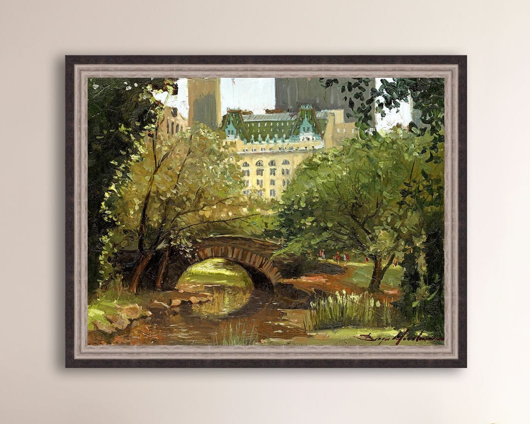 A canvas print of 'Summer in Central Park, New York' featuring bridge in the park and Plaza Hotel in the background.