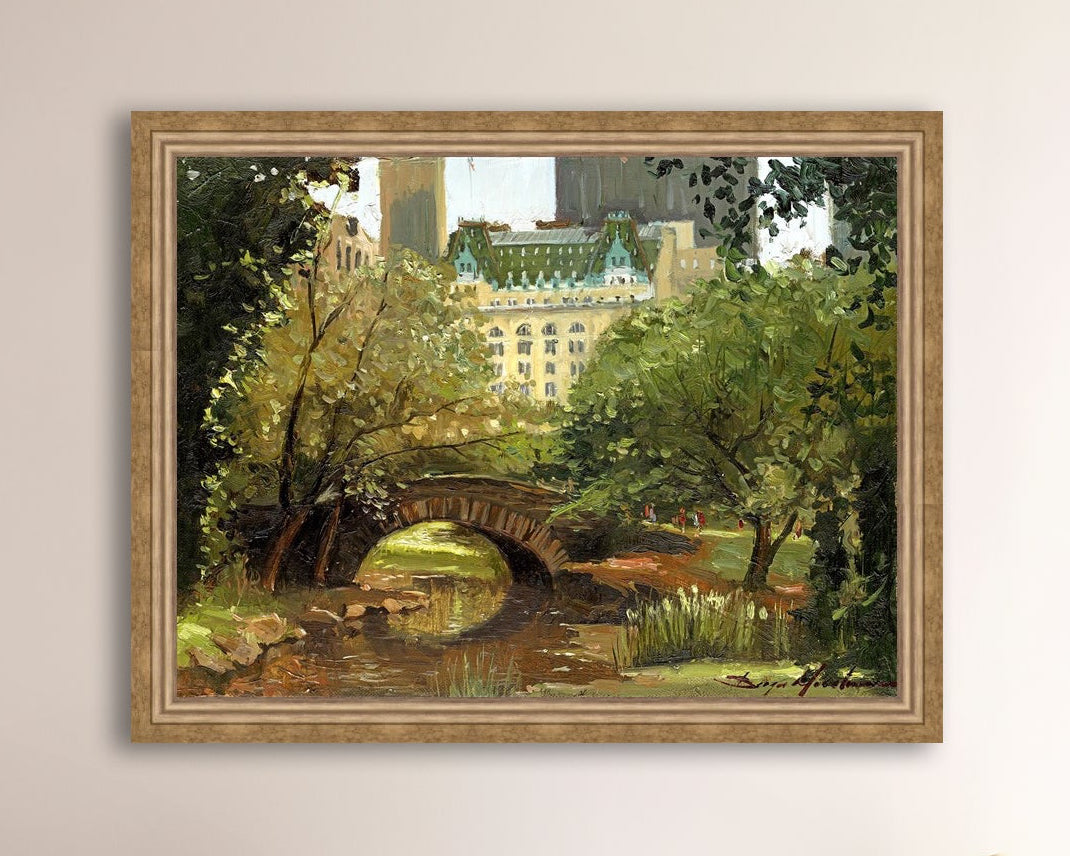 A canvas print of 'Summer in Central Park, New York' featuring bridge in the park and Plaza Hotel in the background.