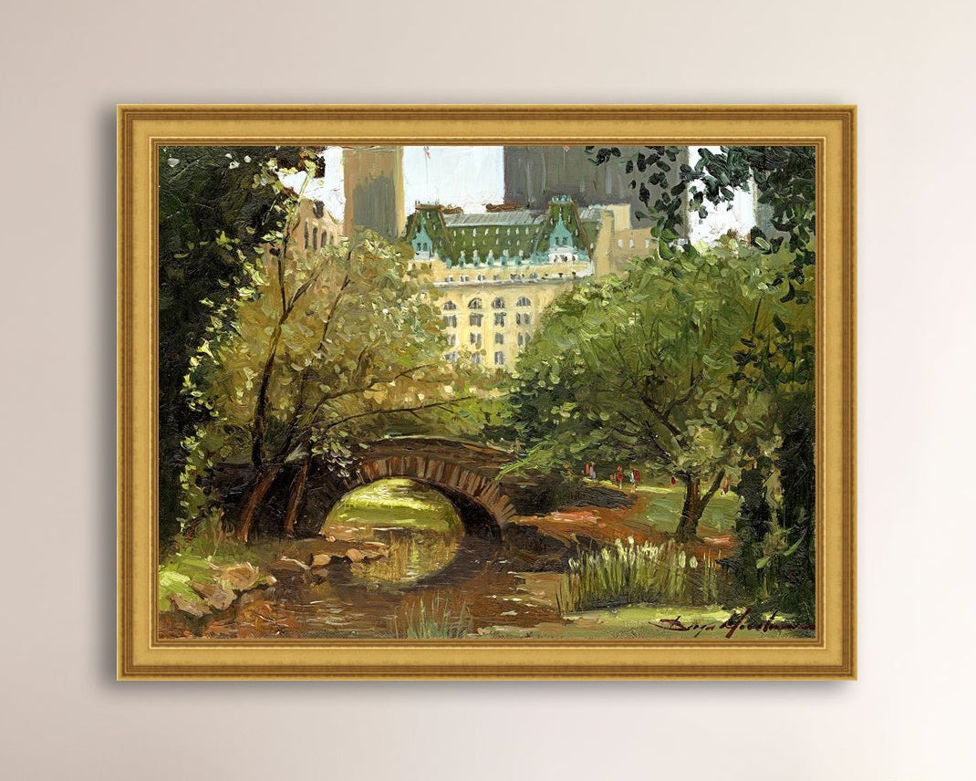 A canvas print of 'Summer in Central Park, New York' featuring bridge in the park and Plaza Hotel in the background.
