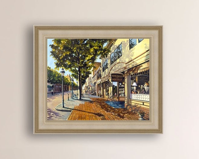 A vibrant giclee canvas print depicting a main street Bethlehem scene with Moravian Book shop.
