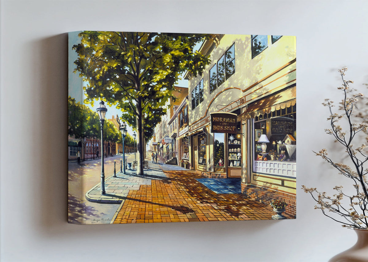 A vibrant giclee canvas print depicting a main street Bethlehem scene with Moravian Book shop.