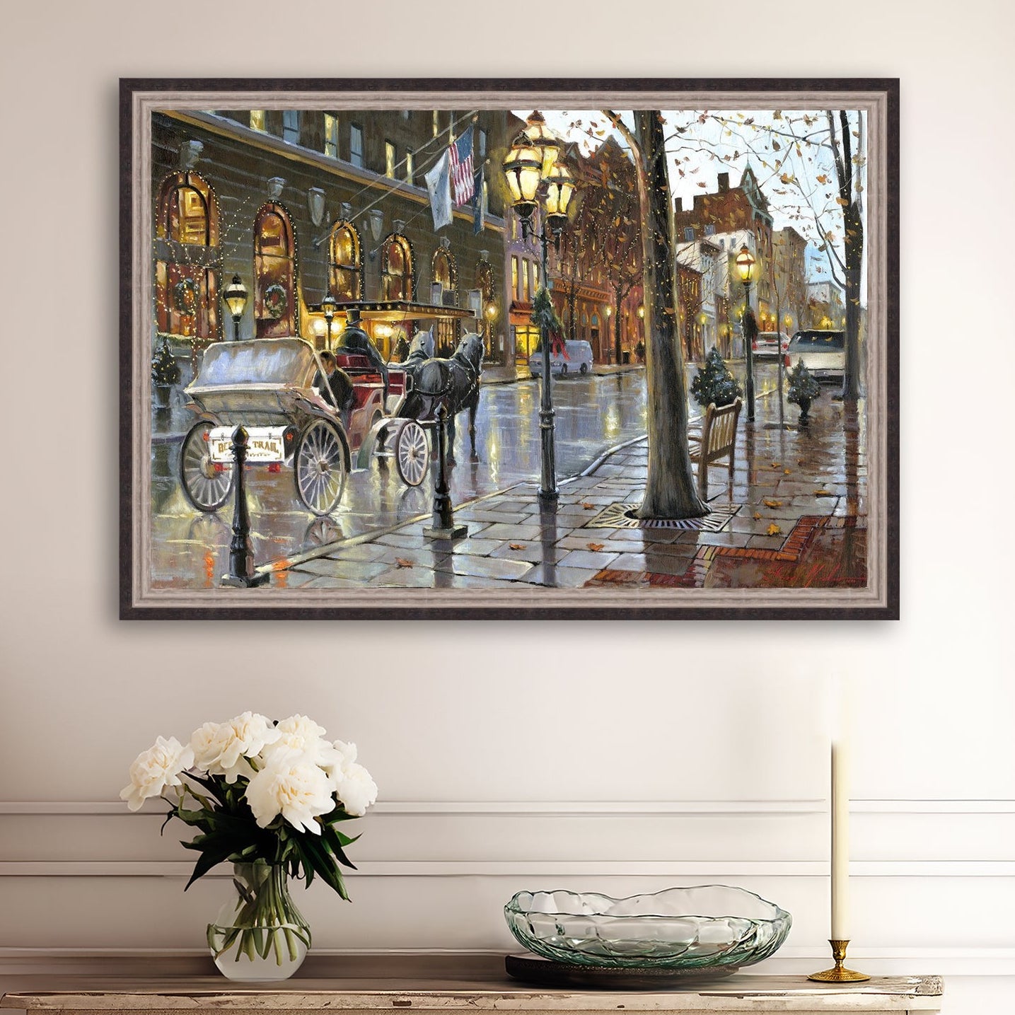 A canvas print depicting a Christmas scene with a horse-drawn carriage on a wet main street in Bethlehem with stores and Christmas lights in the background.