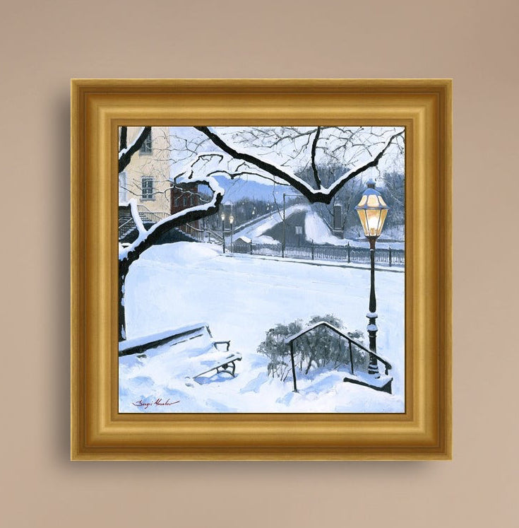 A canvas print featuring a snowy landscape with a bench, a lamp post, in the foreground, and Moravian Church in the background.