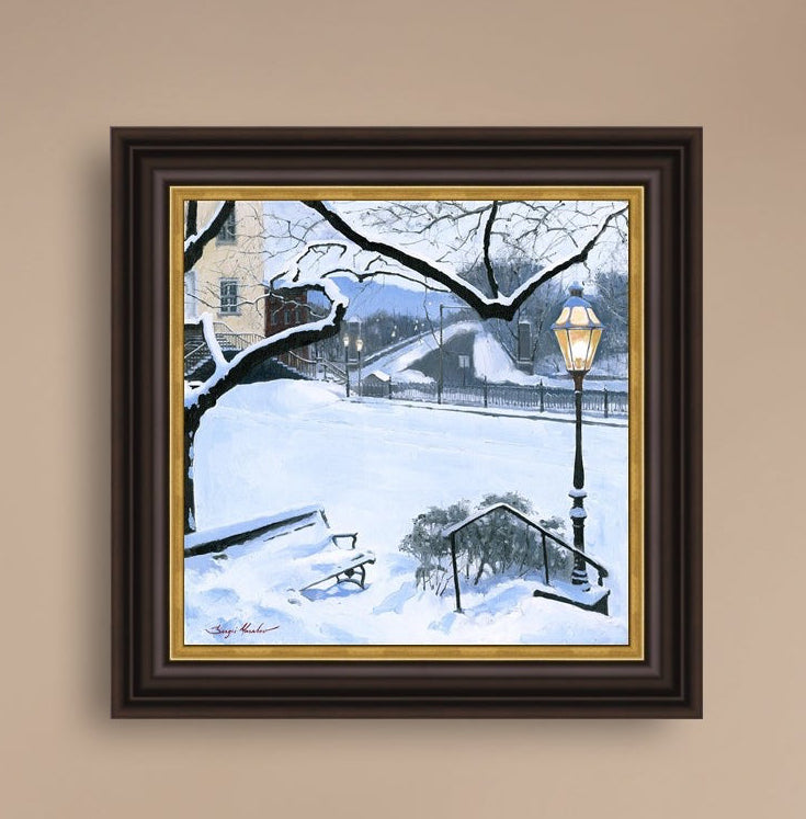 A canvas print featuring a snowy landscape with a bench, a lamp post, in the foreground, and Moravian Church in the background.