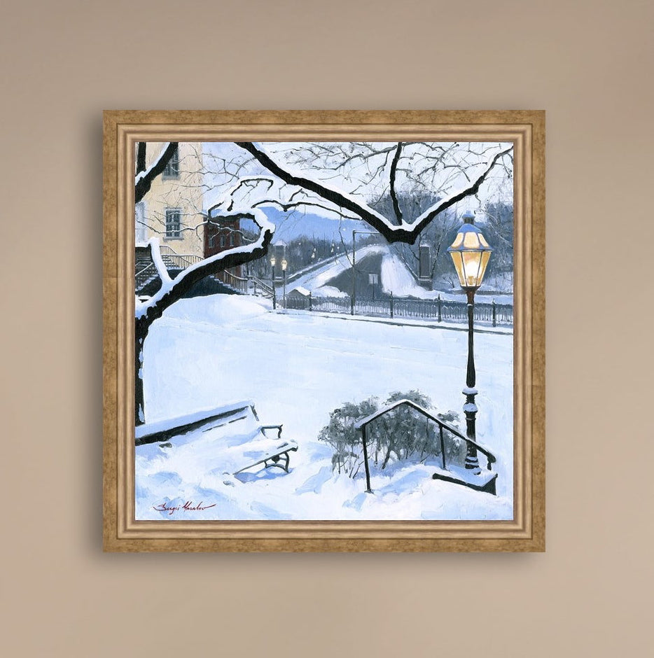 A canvas print featuring a snowy landscape with a bench, a lamp post, in the foreground, and Moravian Church in the background.