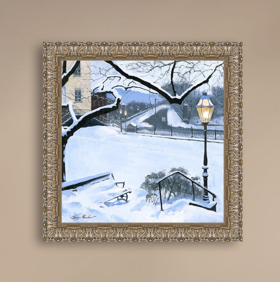 A canvas print featuring a snowy landscape with a bench, a lamp post, in the foreground, and Moravian Church in the background.