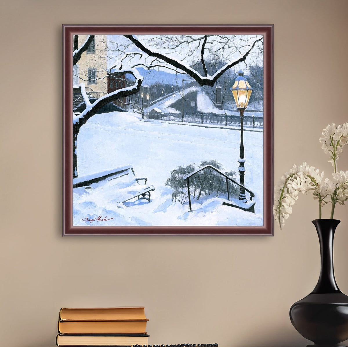 A canvas print featuring a snowy landscape with a bench, a lamp post, in the foreground, and Moravian Church in the background.