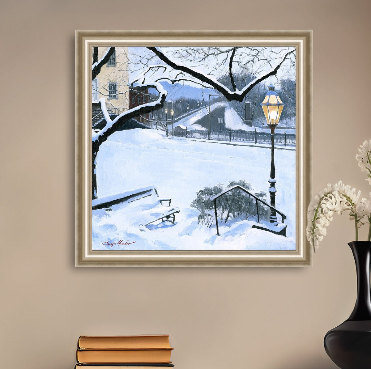A canvas print featuring a snowy landscape with a bench, a lamp post, in the foreground, and Moravian Church in the background.