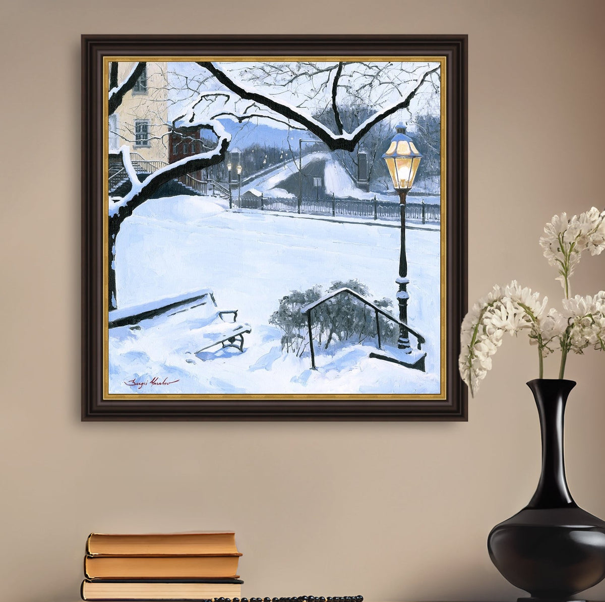 A canvas print featuring a snowy landscape with a bench, a lamp post, in the foreground, and Moravian Church in the background.