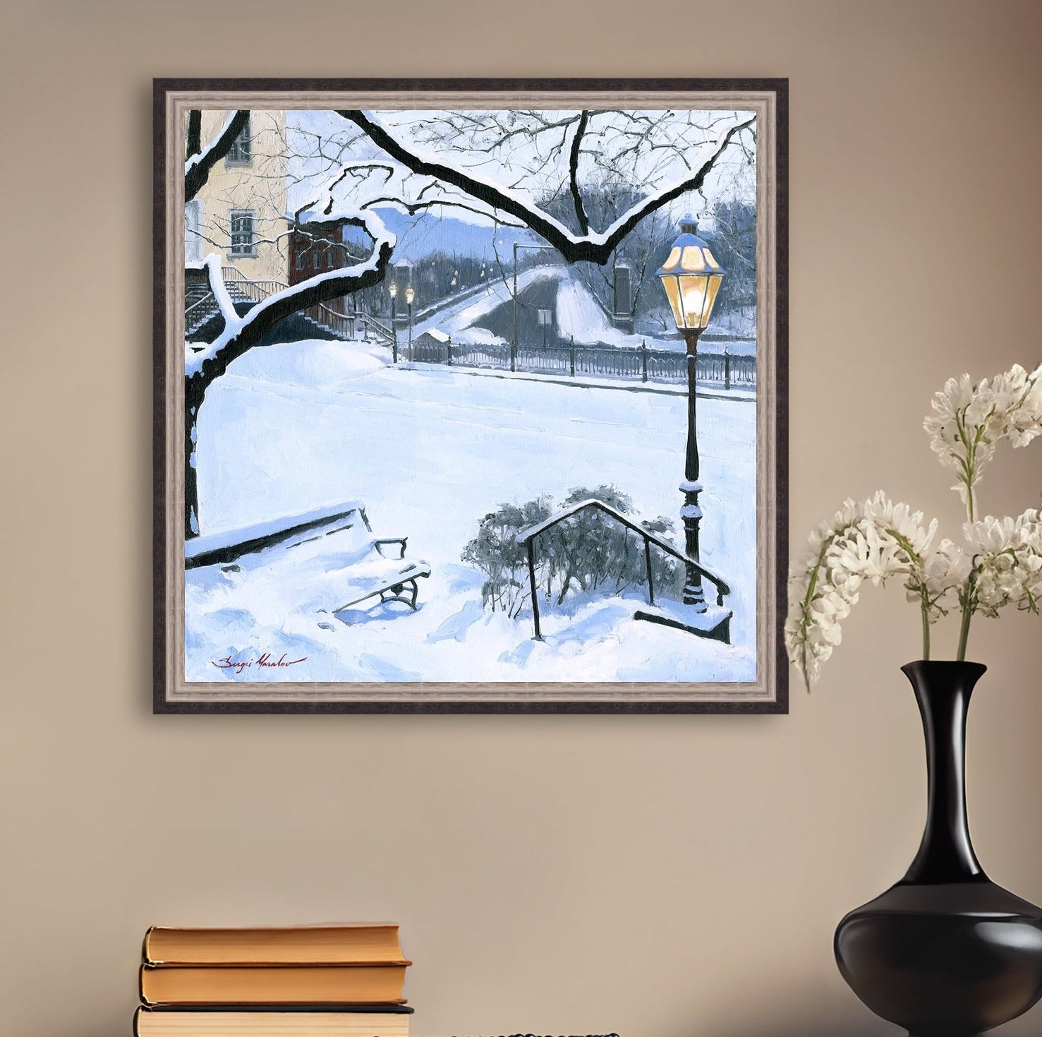A canvas print featuring a snowy landscape with a bench, a lamp post, in the foreground, and Moravian Church in the background.