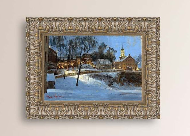 Winter scene with Moravian Church and Main Street, illuminated by lights.