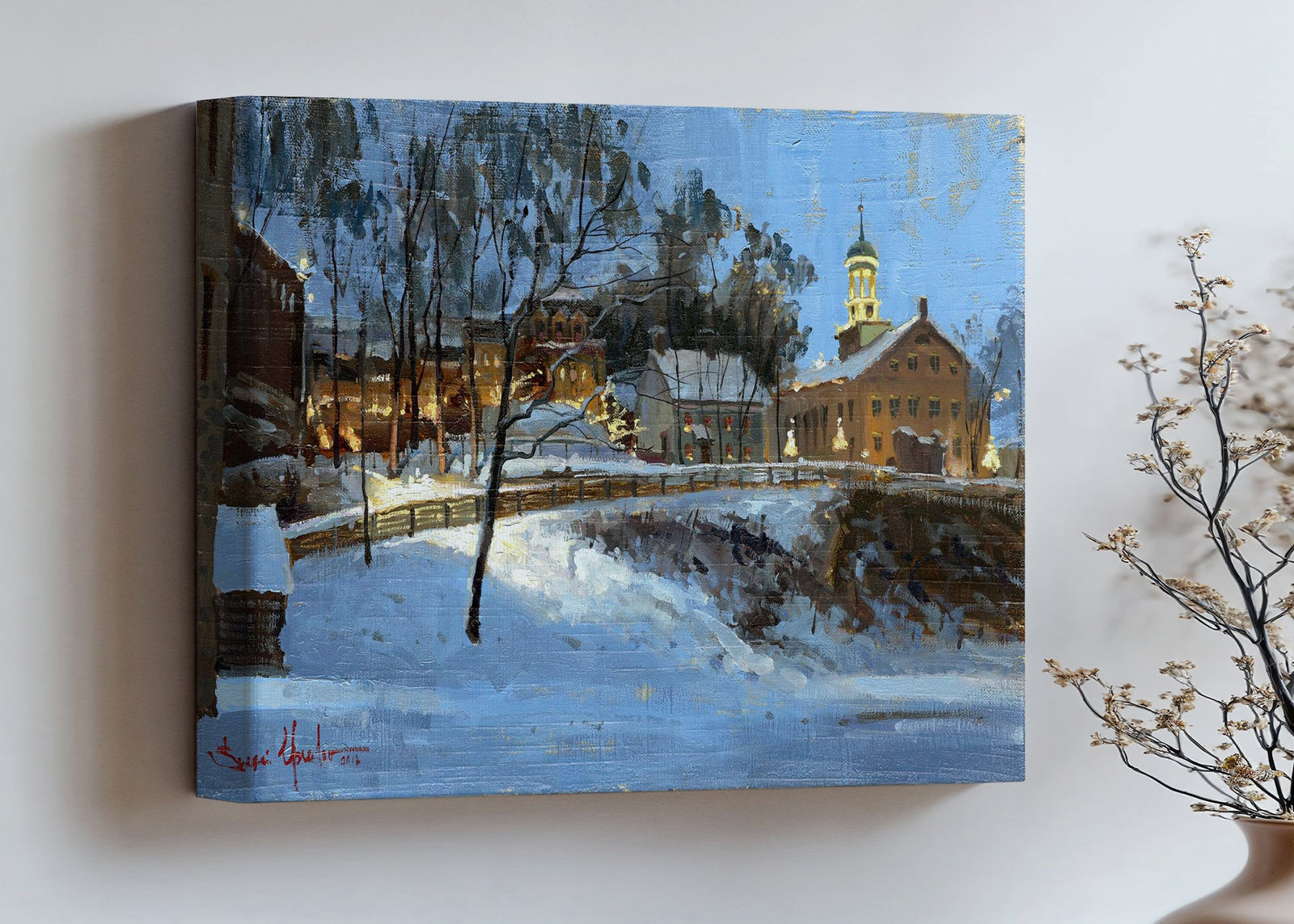 Winter scene with Moravian Church and Main Street, illuminated by lights.