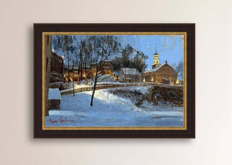 Winter scene with Moravian Church and Main Street, illuminated by lights.