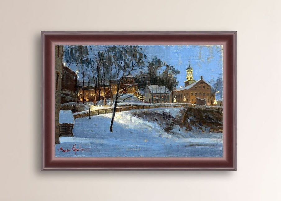 Winter scene with Moravian Church and Main Street, illuminated by lights.