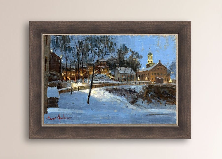 Winter scene with Moravian Church and Main Street, illuminated by lights.