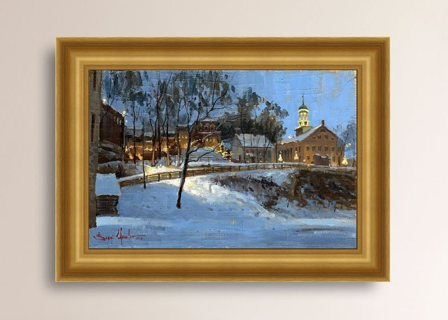 Winter scene with Moravian Church and Main Street, illuminated by lights.