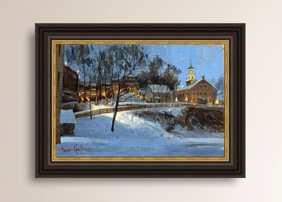 Winter scene with Moravian Church and Main Street, illuminated by lights.