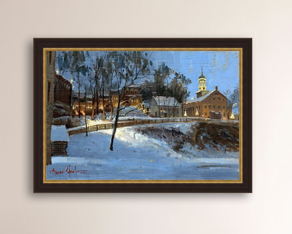 Winter scene with Moravian Church and Main Street, illuminated by lights.