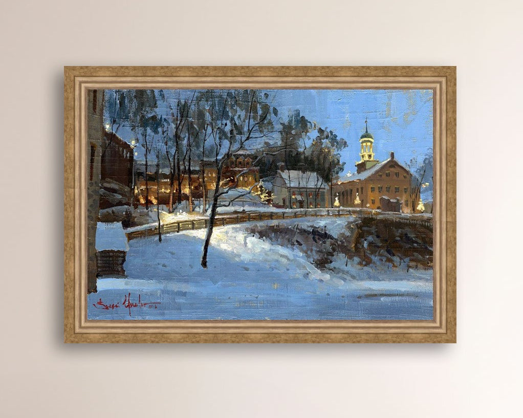 Winter scene with Moravian Church and Main Street, illuminated by lights.