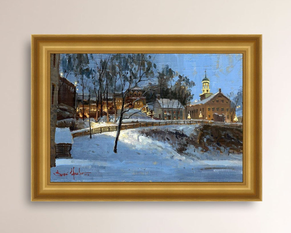Winter scene with Moravian Church and Main Street, illuminated by lights.