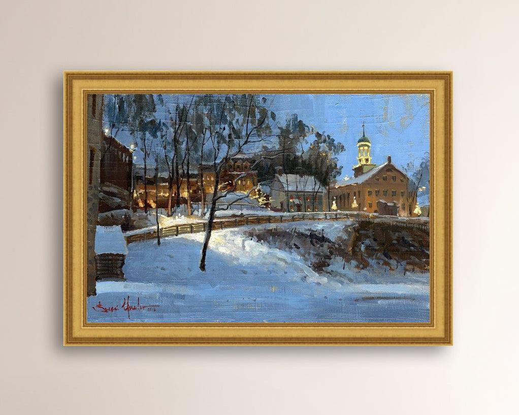 Winter scene with Moravian Church and Main Street, illuminated by lights.