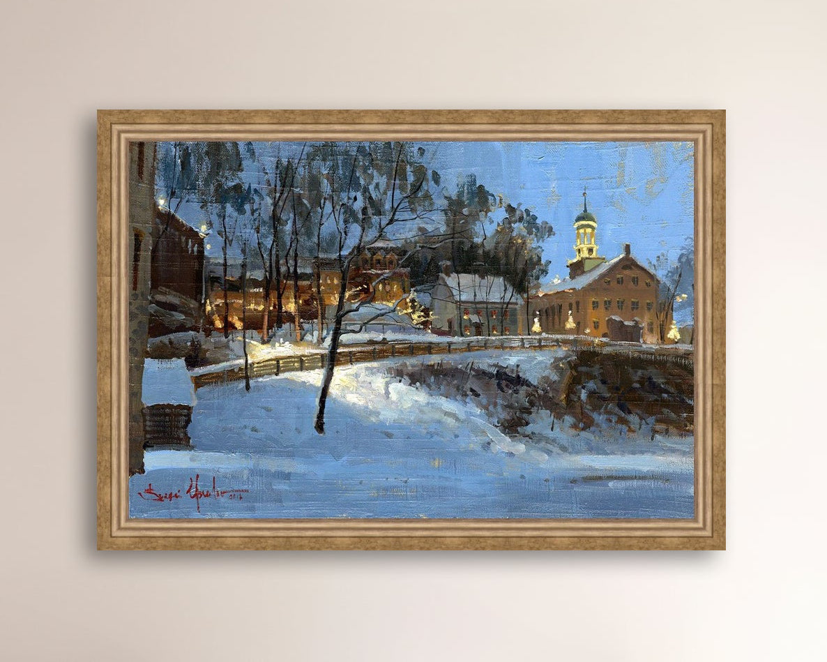 Winter scene with Moravian Church and Main Street, illuminated by lights.