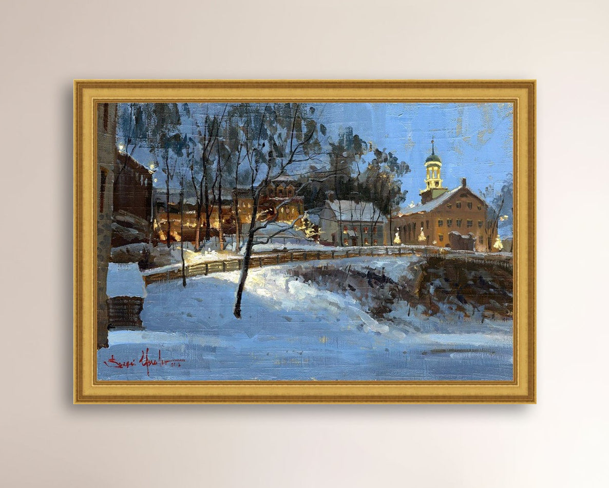 Winter scene with Moravian Church and Main Street, illuminated by lights.