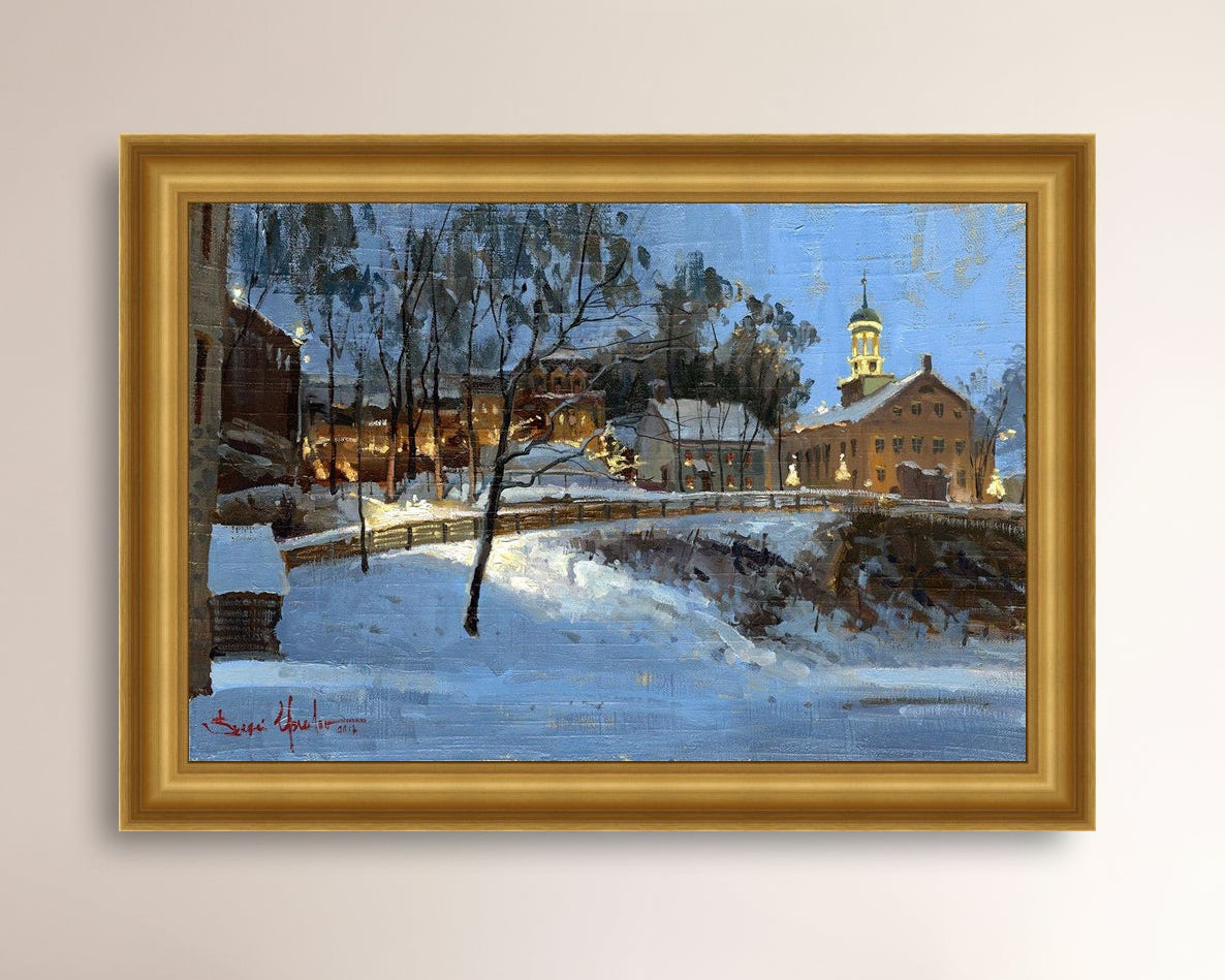 Winter scene with Moravian Church and Main Street, illuminated by lights.