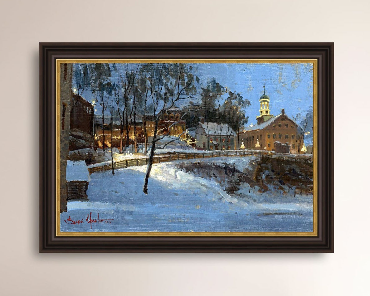 Winter scene with Moravian Church and Main Street, illuminated by lights.