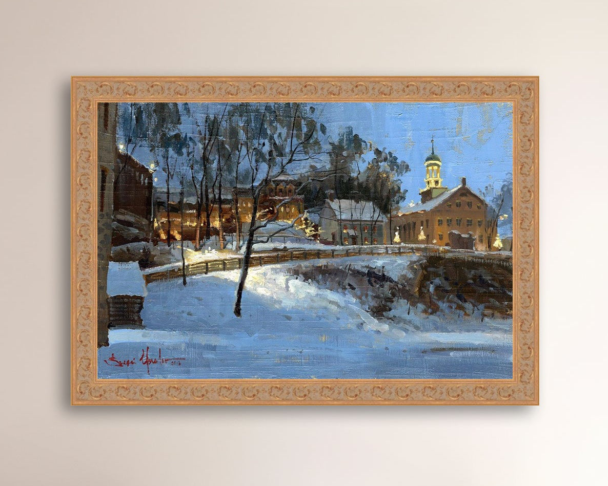 Winter scene with Moravian Church and Main Street, illuminated by lights.