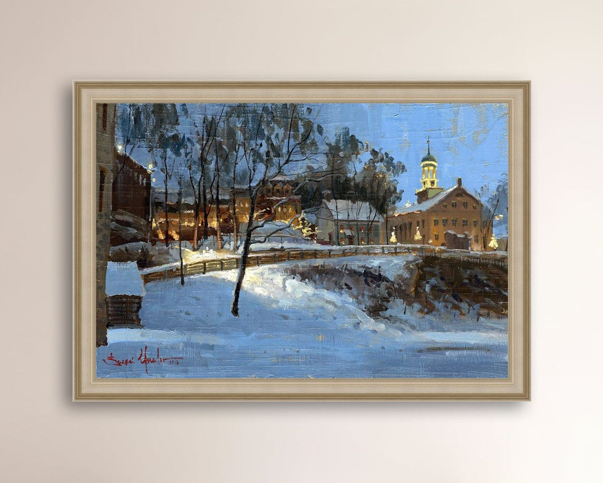 Winter scene with Moravian Church and Main Street, illuminated by lights.