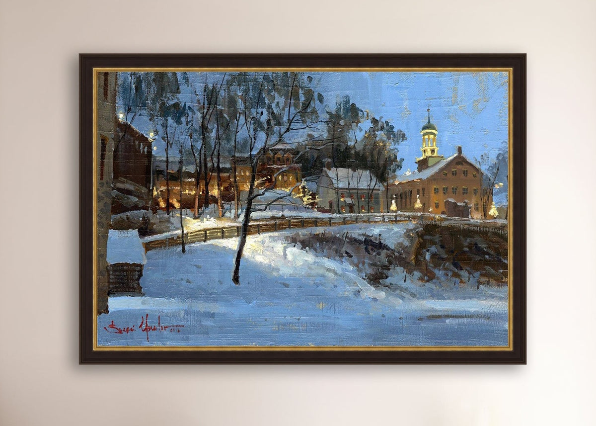 Winter scene with Moravian Church and Main Street, illuminated by lights.