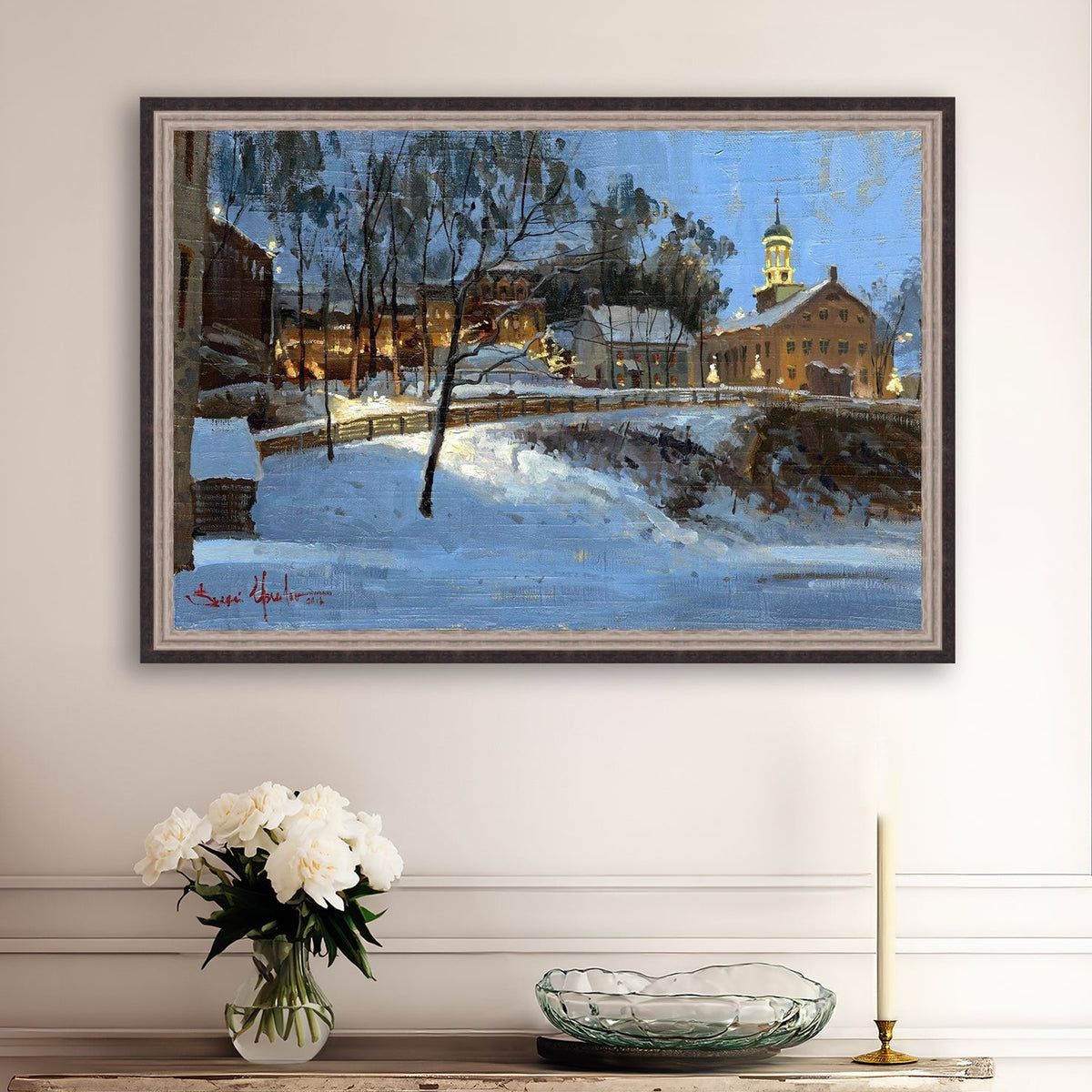 Winter scene with Moravian Church and Main Street, illuminated by lights.