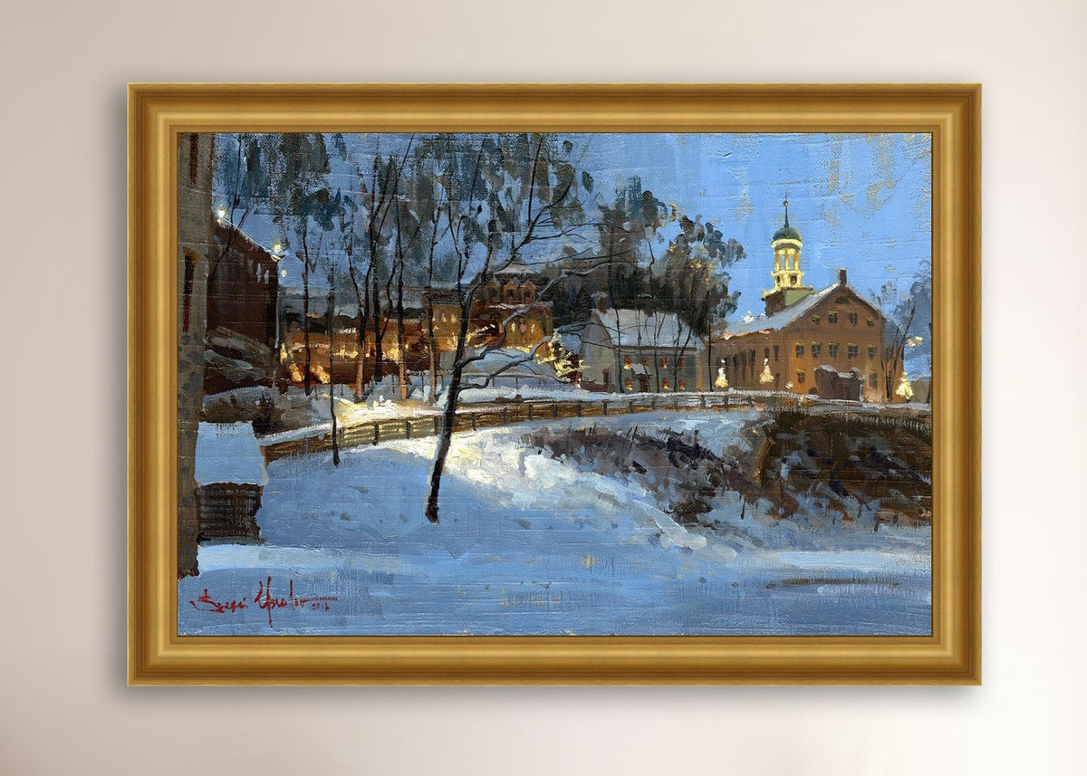 Winter scene with Moravian Church and Main Street, illuminated by lights.