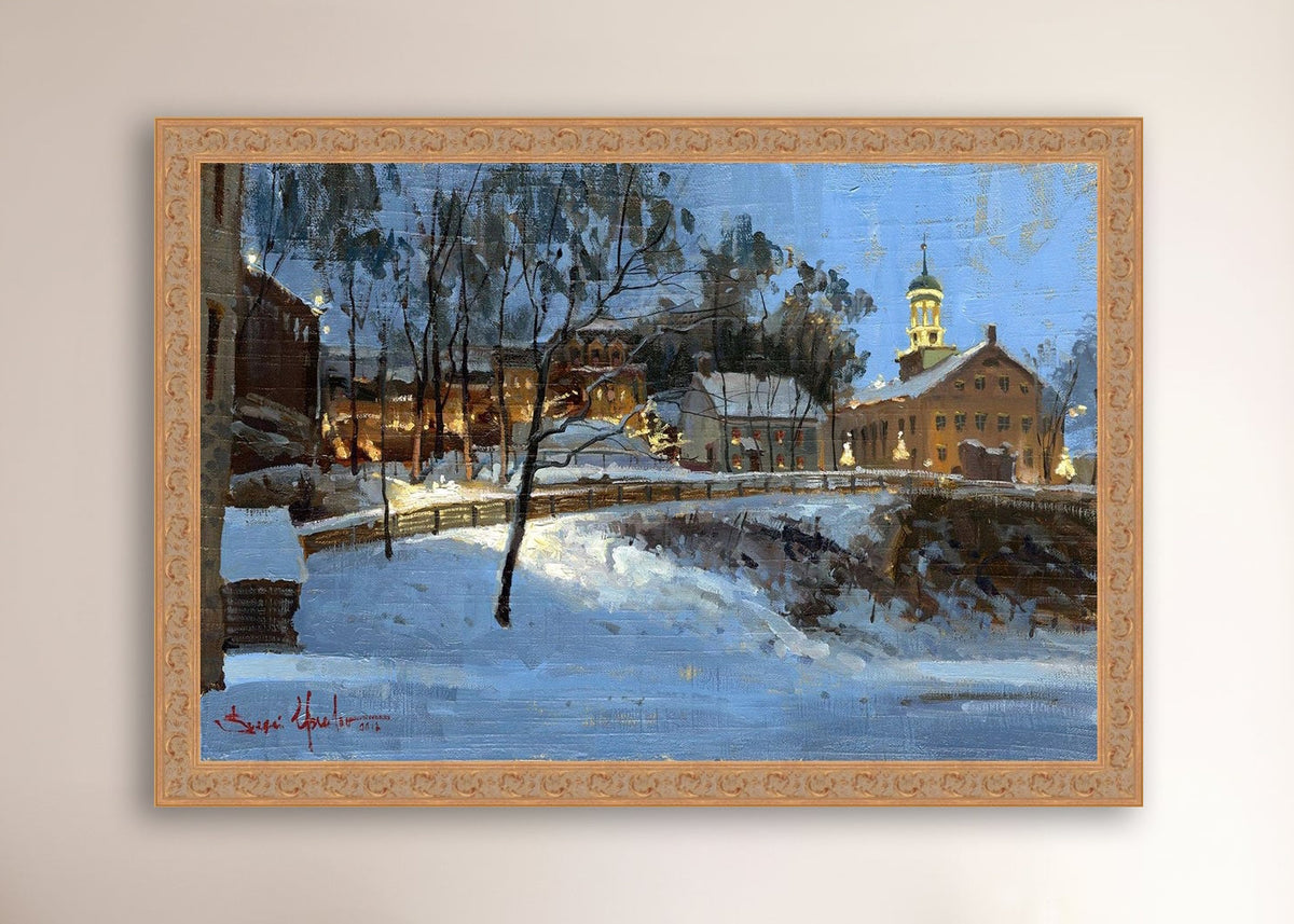 Winter scene with Moravian Church and Main Street, illuminated by lights.