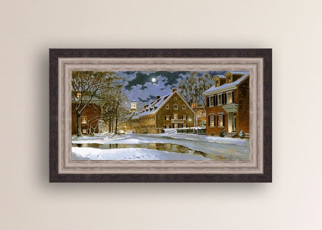 Snowy Bethlehem scene with Moravian Church at night.