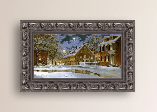 Snowy Bethlehem scene with Moravian Church at night.