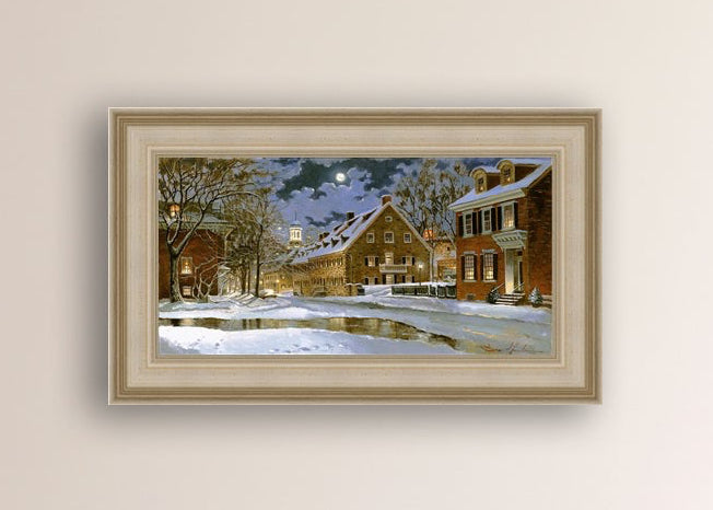 Snowy Bethlehem scene with Moravian Church at night.